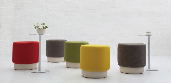 Back view of multiple round chairs in different colors.