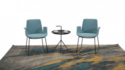 From our Flex line of furniture, two blue chairs with a coffee table between.
