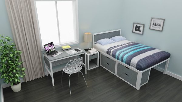 Showing double bed with drawer, grey study table, branch chair, bed side table with drawer, and wooden flooring.