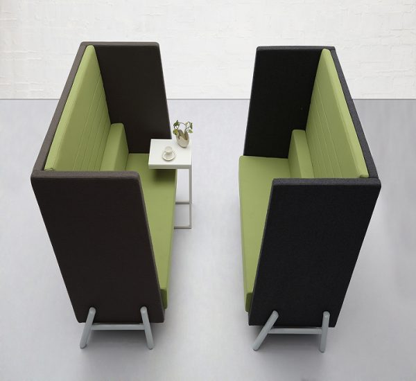 Two high-back flex lounge furniture sofas in green and black.
